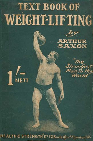 old magazine cover with a man holding a kettlebell above his head
